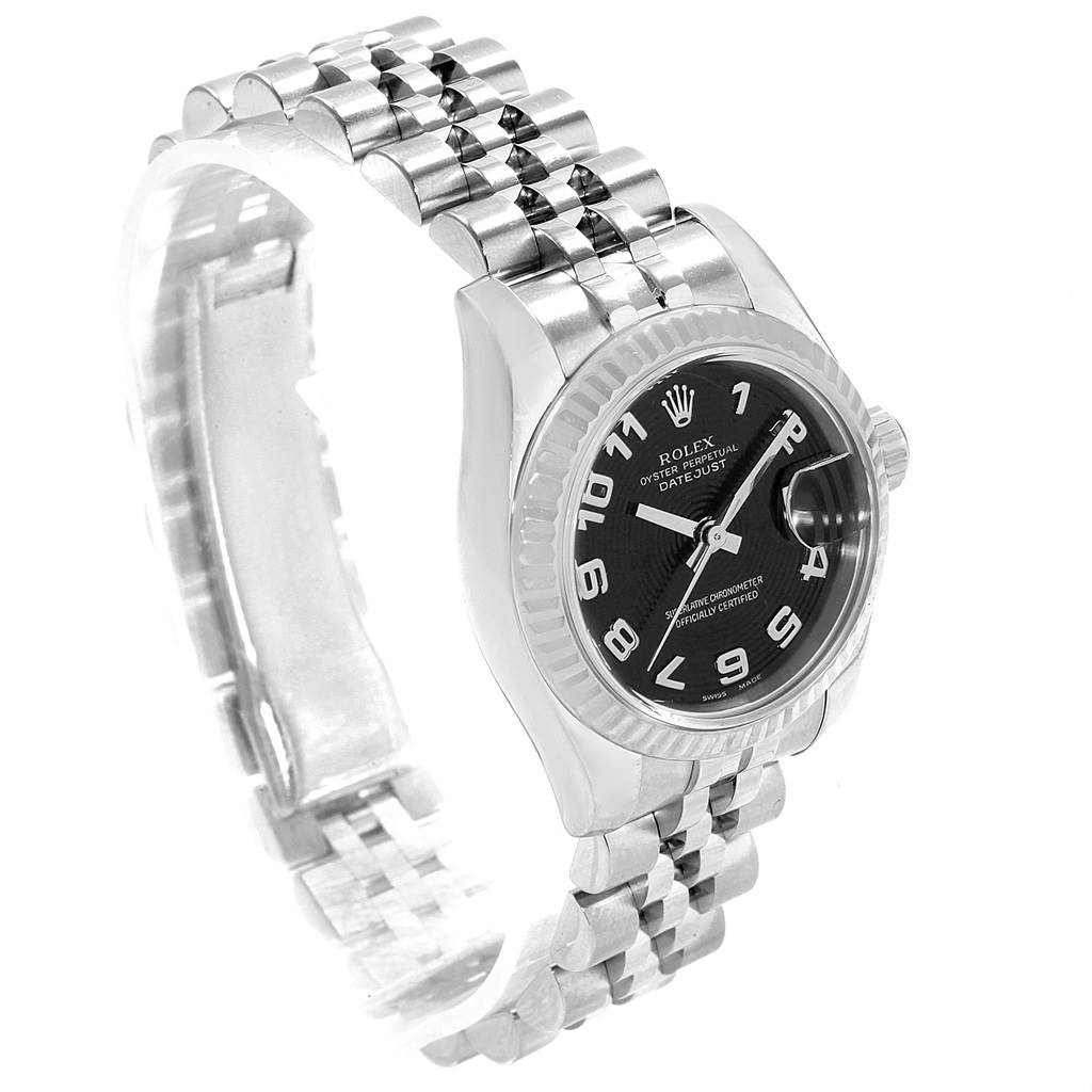 This image shows a side and slightly tilted view of the Rolex Datejust 179174 Women
s Stainless Steel Black Dial 179174 Women
s Stainless Steel Black Dial watch, displaying its face, bezel, and bracelet.