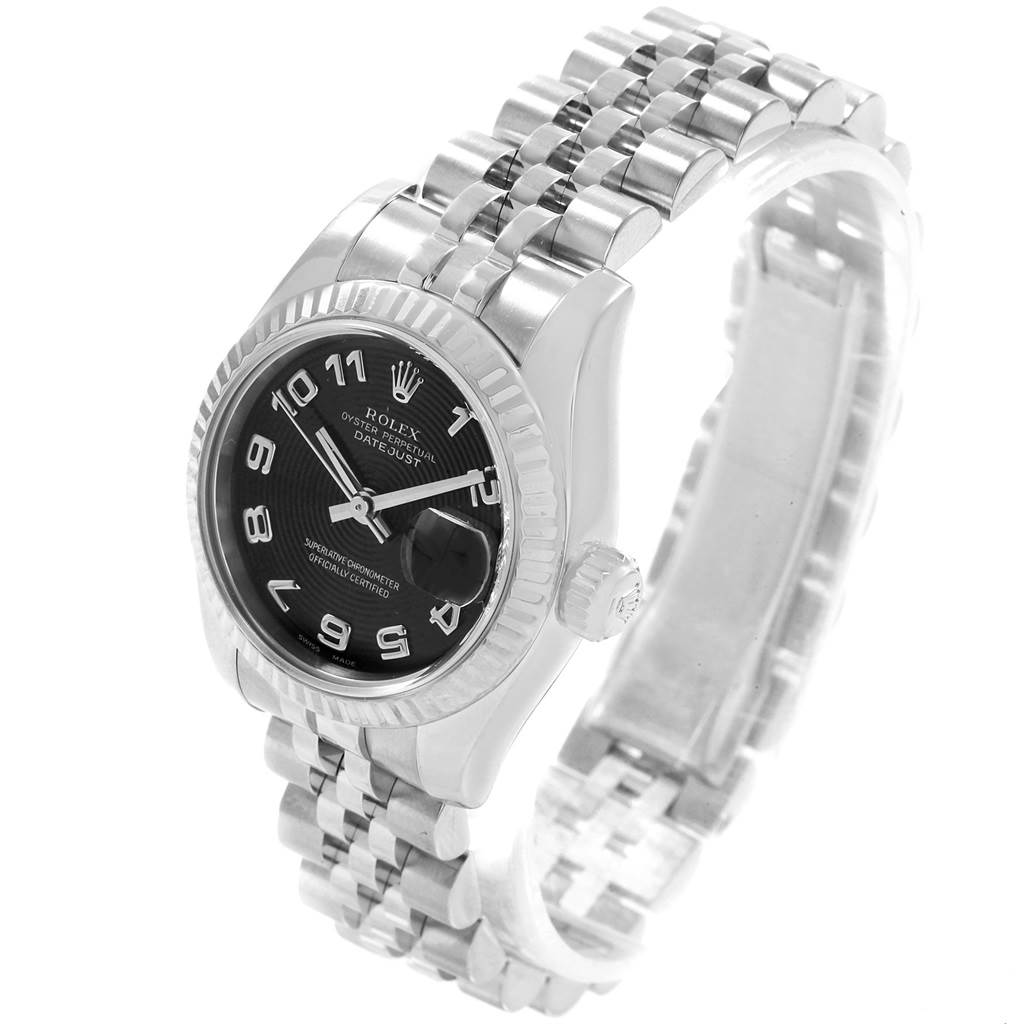The photo shows a Rolex Datejust 179174 Women
s Stainless Steel Black Dial 179174 Women
s Stainless Steel Black Dial watch at an angled top-down view focusing on the dial, bezel, and part of the bracelet.