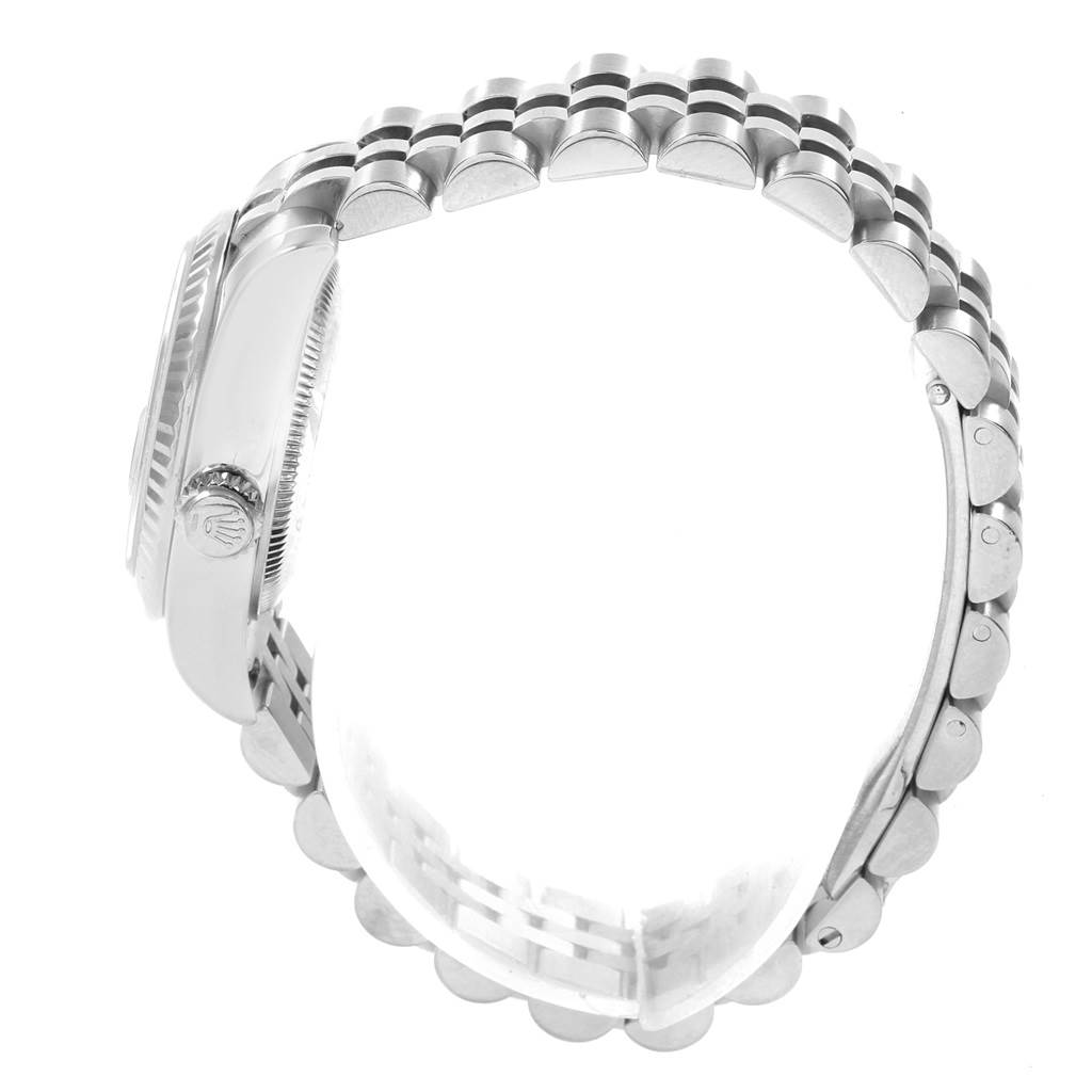 This image shows a side view of a Rolex Datejust 179174 Women
s Stainless Steel Black Dial 179174 Women
s Stainless Steel Black Dial watch, highlighting the bezel, crown, and Jubilee bracelet.