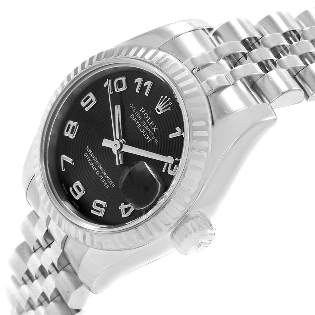 This is a close-up angle of the Rolex Datejust 179174 Women
s Stainless Steel Black Dial 179174 Women
s Stainless Steel Black Dial watch showcasing the dial, bezel, crown, and part of the bracelet.