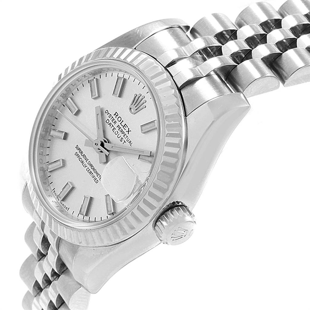 This image shows a side-angle view of a Rolex Datejust 179174 Women's Stainless Steel Silver Dial 179174 Women's Stainless Steel Silver Dial model, highlighting the bezel, dial, crown, and part of the bracelet.