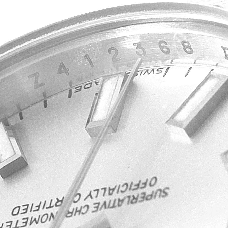 This close-up image of a Rolex Datejust 179174 Women's Stainless Steel Silver Dial 179174 Women's Stainless Steel Silver Dial watch shows the dial, markers, and part of the chapter ring.