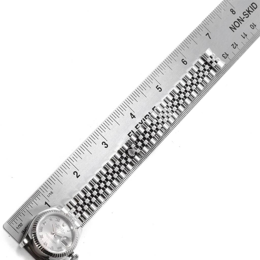 The image shows a Rolex Datejust 179174 Women's Stainless Steel Silver Dial 179174 Women's Stainless Steel Silver Dial watch laid flat with a ruler measuring its band.