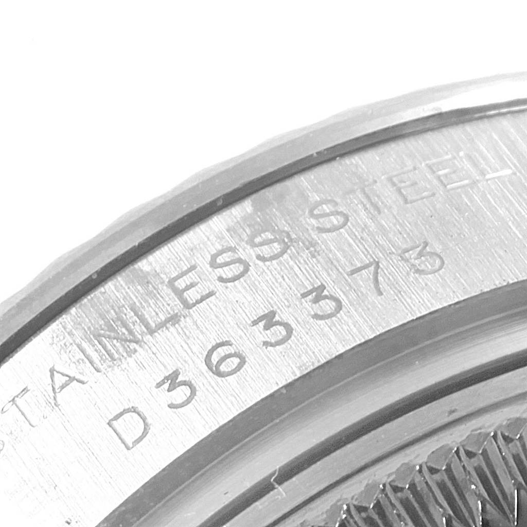 This image shows a close-up of the engraved stainless steel caseback of a Rolex Datejust 179174 Women's Stainless Steel Silver Dial 179174 Women's Stainless Steel Silver Dial watch.