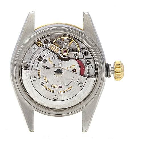 This image shows the back view of a Rolex Datejust 79173 Women's Stainless Steel Beige Dial 79173 Women's Stainless Steel Beige Dial watch case, revealing its internal mechanical movement and crown.
