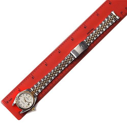 The image shows a Rolex Datejust 79173 Women's Stainless Steel Beige Dial 79173 Women's Stainless Steel Beige Dial watch laid flat against a red ruler, displaying the watch face, bracelet, and clasp.