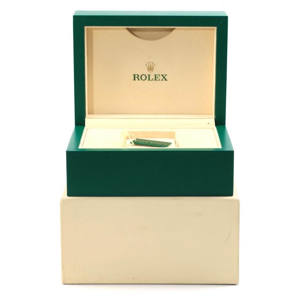 This image shows an open green and cream box for a Rolex Datejust 179174 Women's Stainless Steel Mother of Pearl Dial 179174 Women's Stainless Steel Mother of Pearl Dial model, displaying the interior compartments and a tag.