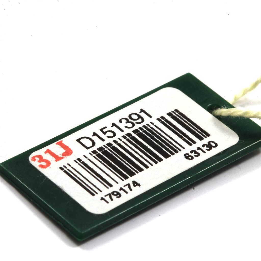 This is a close-up of a green tag with a barcode and serial number for a Rolex Datejust 179174 Women's Stainless Steel Mother of Pearl Dial 179174 Women's Stainless Steel Mother of Pearl Dial watch.