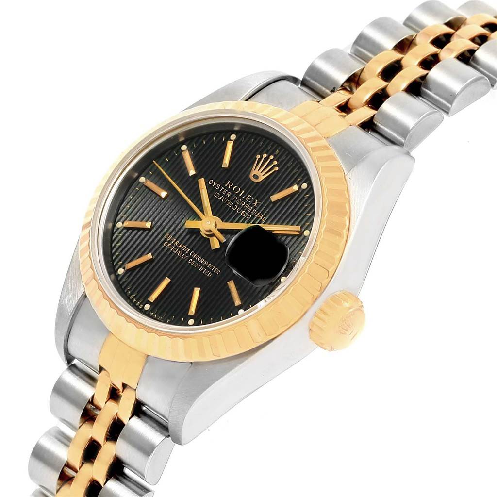 The image shows a close-up, angled view of the Rolex Datejust 69173 Women's Stainless Steel Black Dial 69173 Women's Stainless Steel Black Dial watch, highlighting the face, bezel, and partially the bracelet.