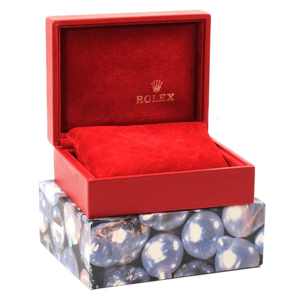 The image shows an open red Rolex Datejust 69173 Women's Stainless Steel Black Dial 69173 Women's Stainless Steel Black Dial watch box with an interior cushion.