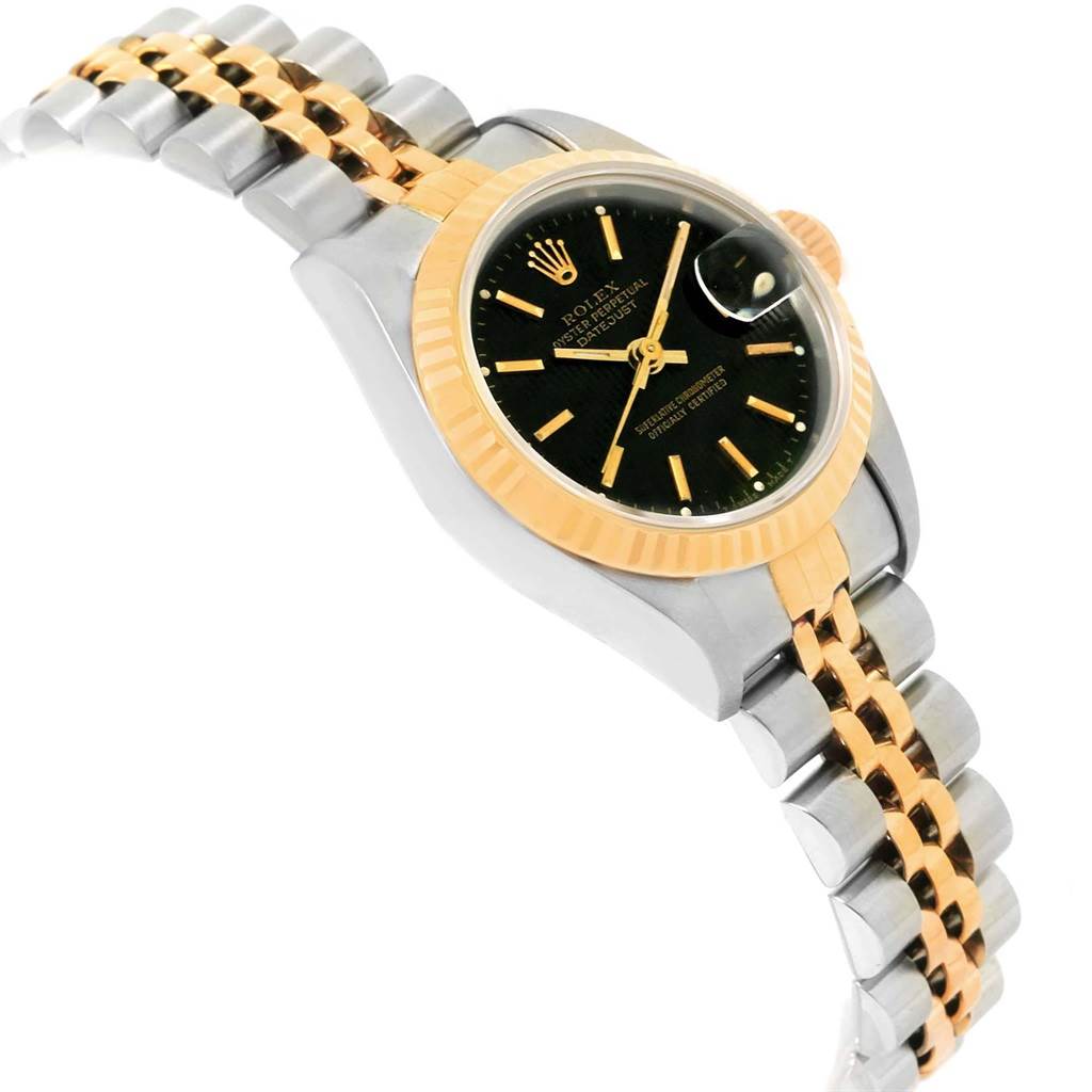 The image shows a side angle of a Rolex Datejust 69173 Women's Stainless Steel Black Dial 69173 Women's Stainless Steel Black Dial, highlighting its two-tone bracelet and the watch face with a cyclops lens over the date.
