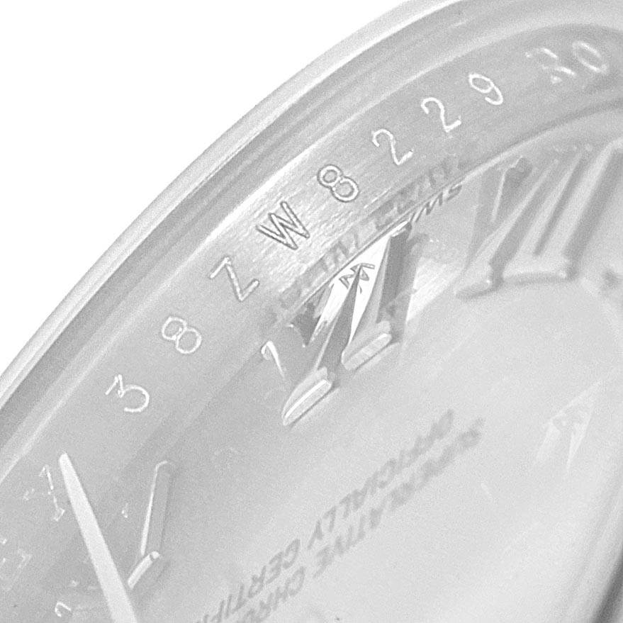 The image shows a close-up of the dial and rehaut of a Rolex Datejust 179160 Women's Stainless Steel Silver Dial 179160 Women's Stainless Steel Silver Dial, revealing the Roman numeral markers and partial serial numbers.