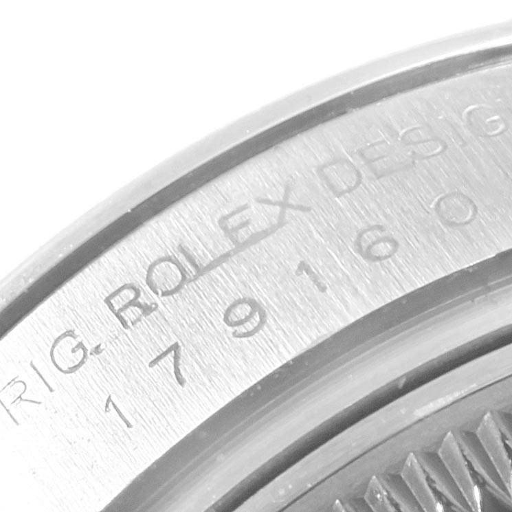 The image shows an engraved section of the case back of a Rolex Datejust 179160 Women's Stainless Steel Silver Dial 179160 Women's Stainless Steel Silver Dial watch at a close-up angle.