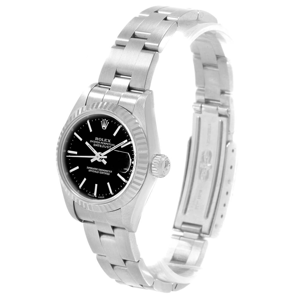 The image shows a Rolex Datejust 79174 Women's Stainless Steel Black Dial 79174 Women's Stainless Steel Black Dial watch at a three-quarter angle, highlighting its face, bezel, crown, and stainless steel bracelet.