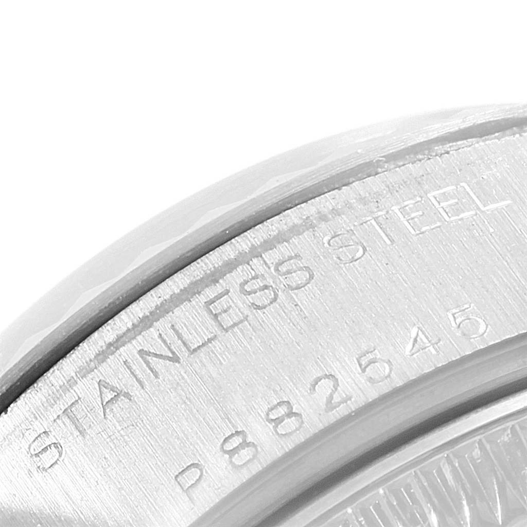 The image shows a close-up of the stainless steel back case of a Rolex Datejust 79174 Women's Stainless Steel Black Dial 79174 Women's Stainless Steel Black Dial watch.