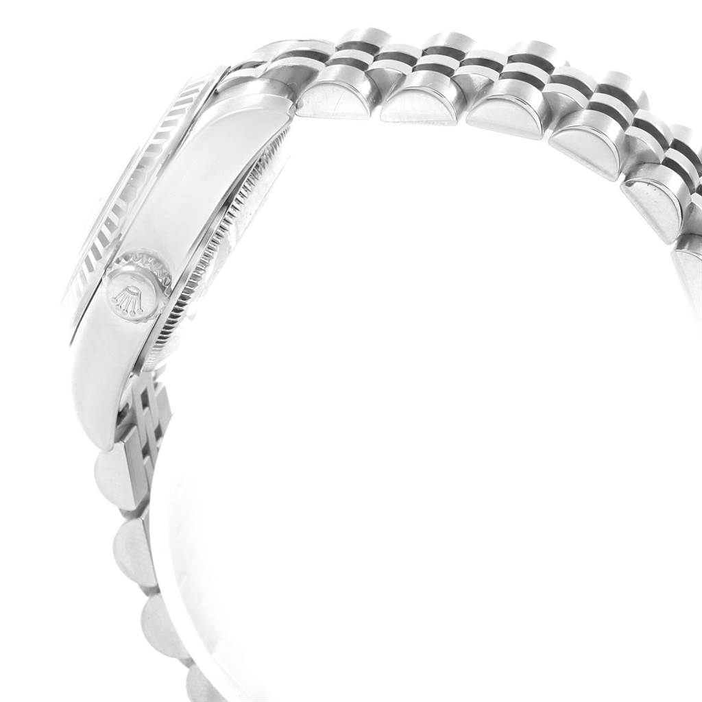 This image shows a side profile of a Rolex Datejust 179174 Women's Stainless Steel Black Dial 179174 Women's Stainless Steel Black Dial watch, focusing on the crown and part of the bracelet.