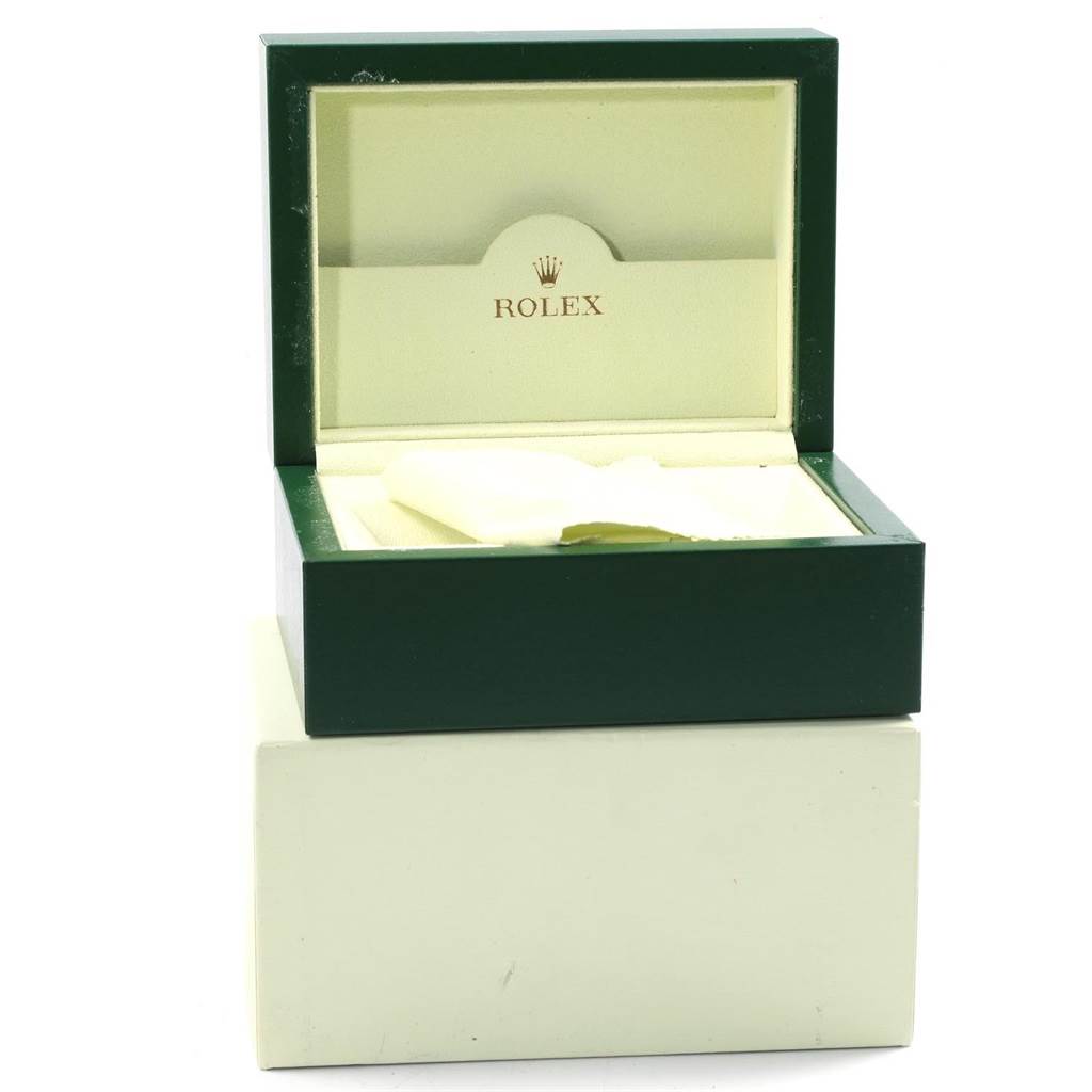 This image shows an open green Rolex watch box, for the Datejust model, displaying the interior with a white cushion.