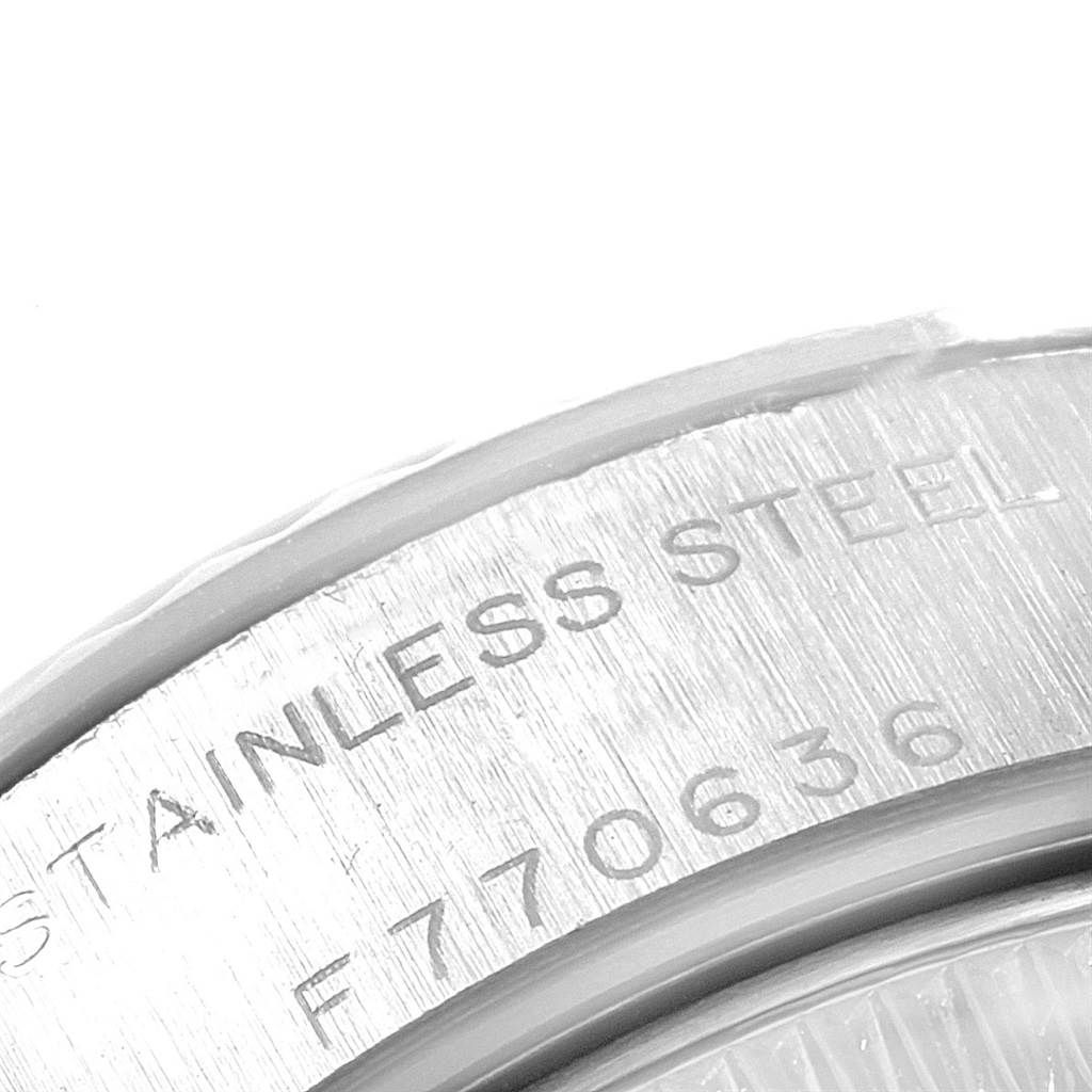 The image shows a close-up of the case back's engraving of the Rolex Datejust 79174 Women's Stainless Steel Mother of Pearl Dial 79174 Women's Stainless Steel Mother of Pearl Dial model, indicating stainless steel material.