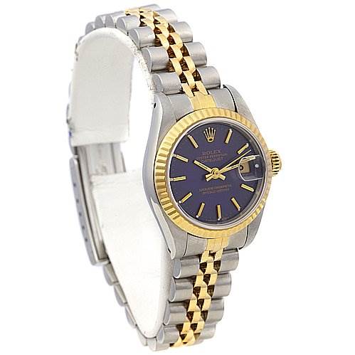 The image shows a side angle of a Rolex Datejust 69173 Women's Stainless Steel Blue Dial 69173 Women's Stainless Steel Blue Dial watch, highlighting the dual-tone bracelet, blue dial, date window, and fluted bezel.