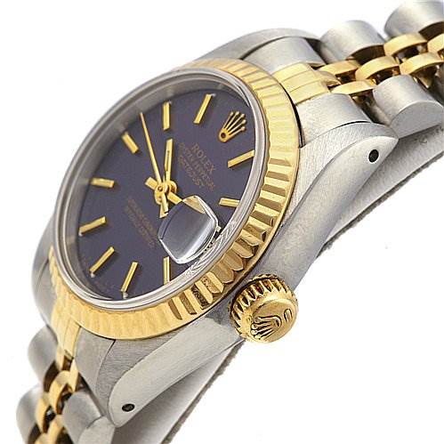 The image shows the side view of a Rolex Datejust 69173 Women's Stainless Steel Blue Dial 69173 Women's Stainless Steel Blue Dial, highlighting the crown, bezel, dial, and part of the bracelet.