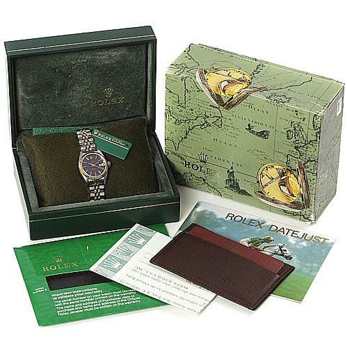 The image shows a Rolex Datejust 69173 Women's Stainless Steel Blue Dial 69173 Women's Stainless Steel Blue Dial watch in its original box with accompanying accessories, including manuals, a wallet, and paperwork.