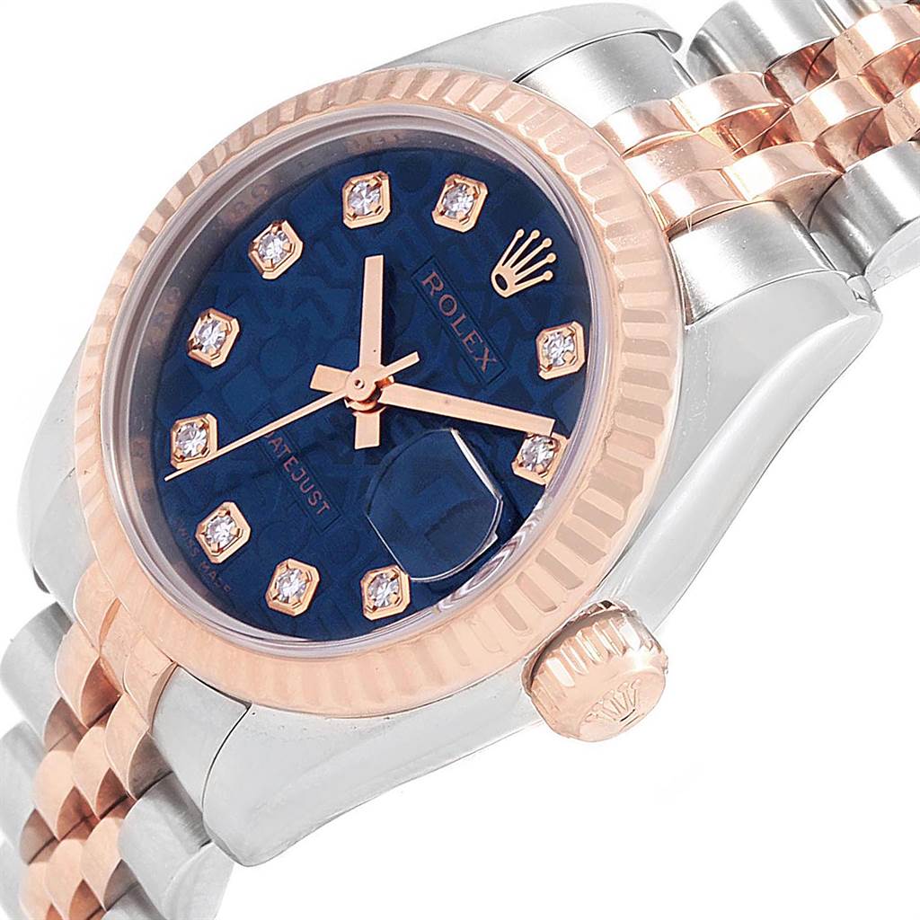 This image shows a Rolex Datejust 179171 Women
s Steel and Gold (two tone) Blue Dial 179171 Women
s Steel and Gold (two tone) Blue Dial watch at an angle highlighting the face, bezel, crown, and part of the bracelet.