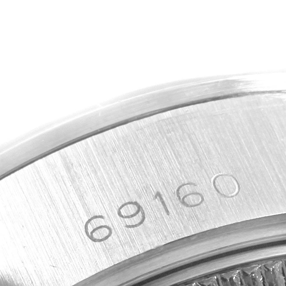 The image shows a close-up of the Rolex Datejust 69160 Women's Stainless Steel Black Dial 69160 Women's Stainless Steel Black Dial model's brushed metal case with the model number 69160 engraved.