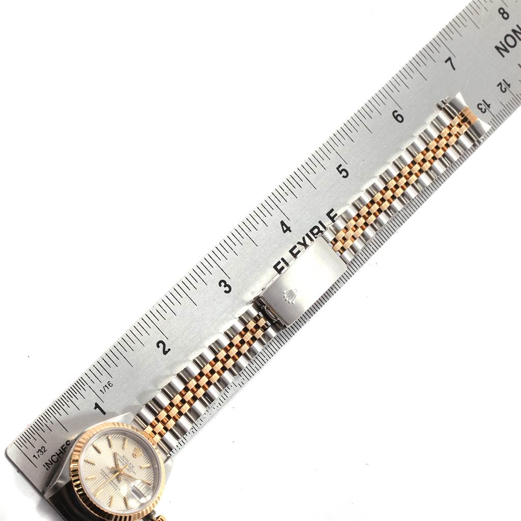 The image shows a Rolex Datejust 69173 Women's Stainless Steel Silver Dial 69173 Women's Stainless Steel Silver Dial watch laid flat next to a ruler, displaying the bracelet and a portion of the watch face.