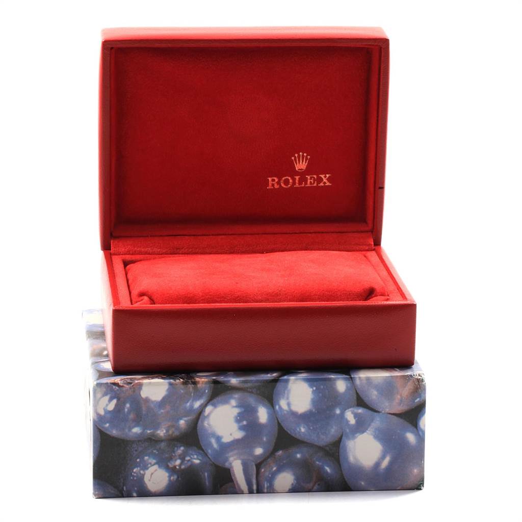 This image shows an empty red Rolex Datejust 69173 Women's Stainless Steel Silver Dial 69173 Women's Stainless Steel Silver Dial watch box, open and viewed from the front.