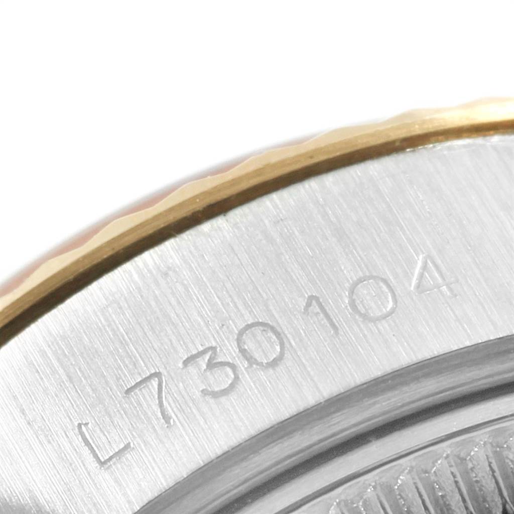 Close-up view of the engraved serial number on the casing of a Rolex Datejust 69173 Women's Stainless Steel Silver Dial 69173 Women's Stainless Steel Silver Dial watch.