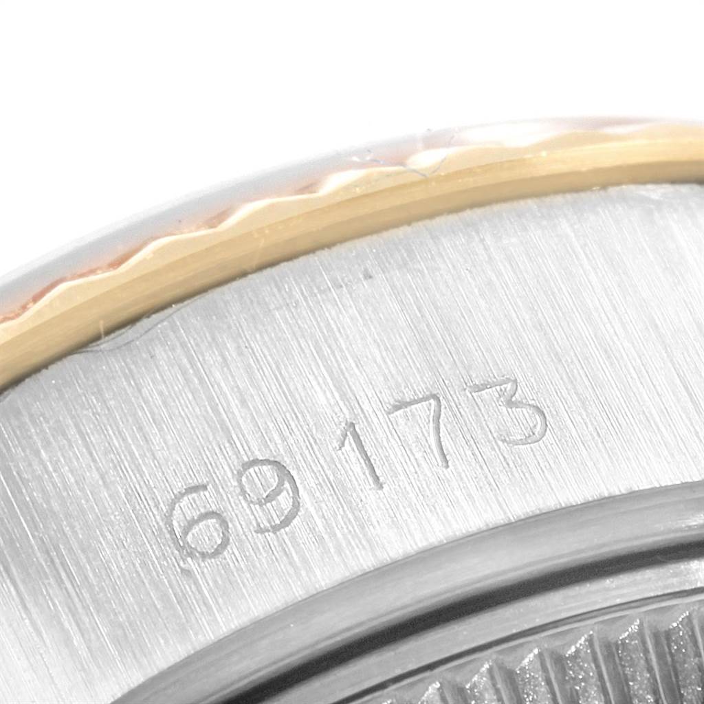 This image shows a macro view of the case back and serial number engraving of a Rolex Datejust 69173 Women's Stainless Steel Silver Dial 69173 Women's Stainless Steel Silver Dial watch.