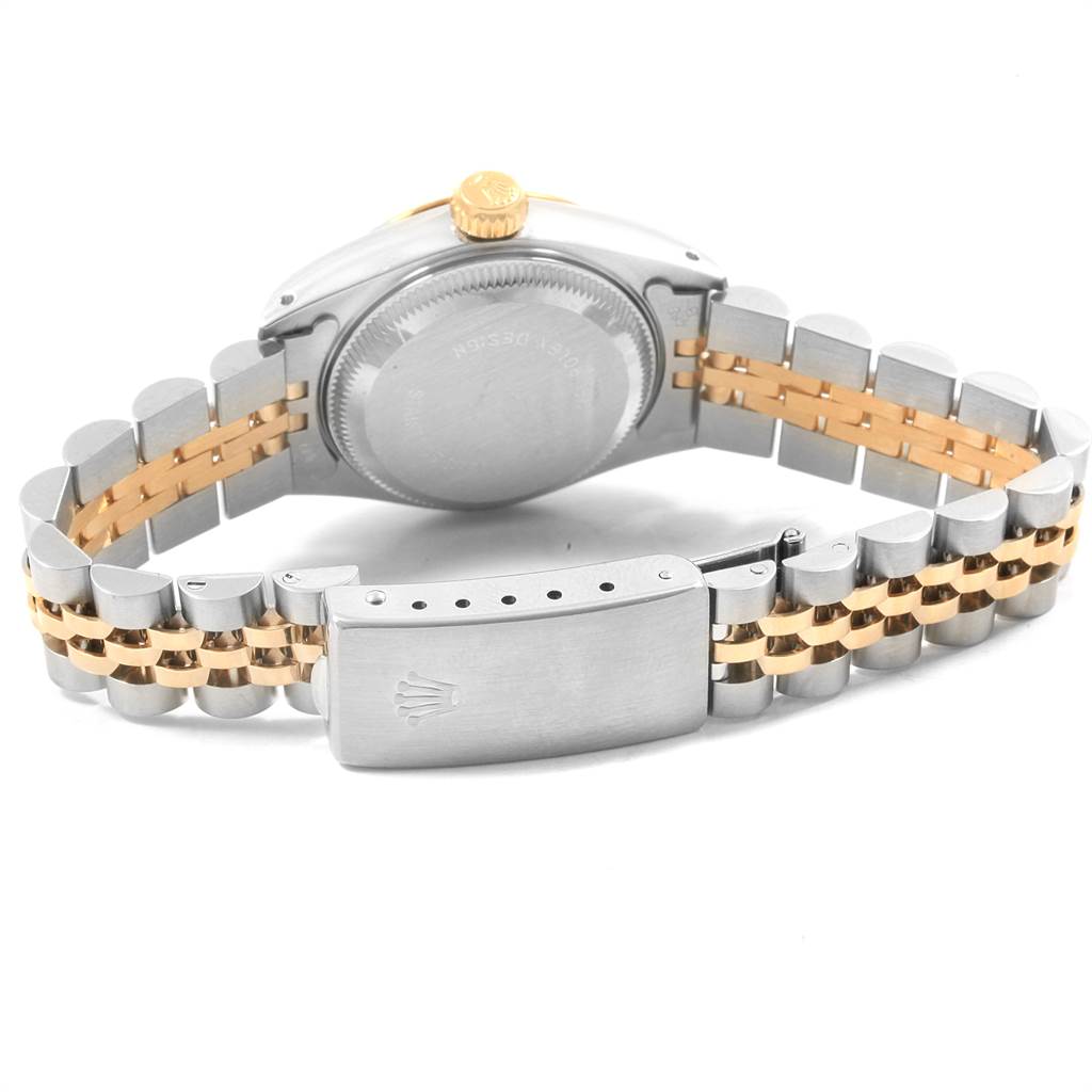 The image shows the back of the Rolex Datejust 69173 Women's Stainless Steel Silver Dial 69173 Women's Stainless Steel Silver Dial watch, focusing on its case, crown, and two-tone Jubilee bracelet.