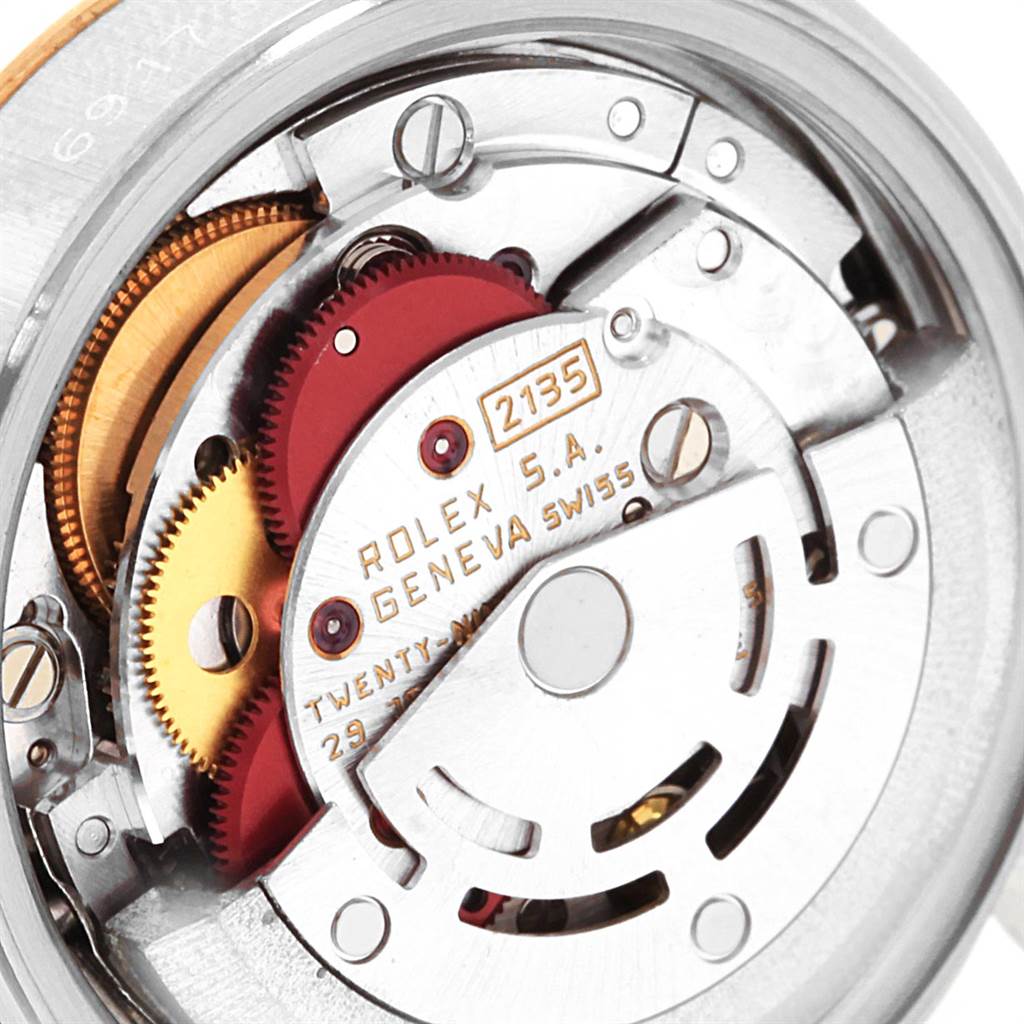 This is a close-up view of the internal movement parts of a Rolex Datejust 69173 Women's Stainless Steel Silver Dial 69173 Women's Stainless Steel Silver Dial watch, emphasizing gears and mechanical components.