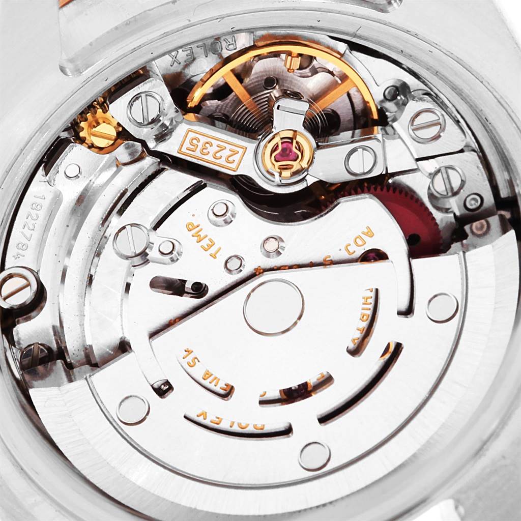 This image shows a close-up view of the movement and inner workings of a Rolex Datejust 179171 Women's Steel and Gold (two tone) Black Dial 179171 Women's Steel and Gold (two tone) Black Dial watch.