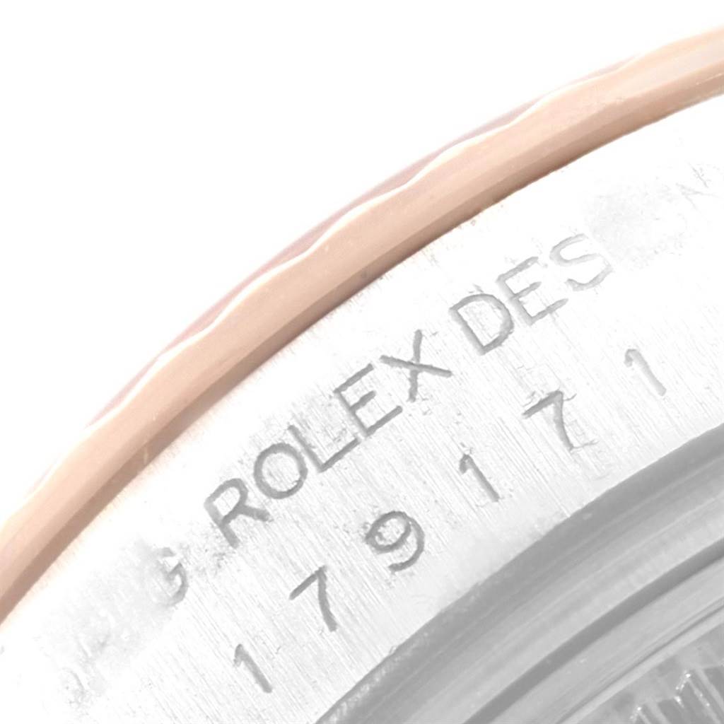 The image shows a close-up of the engraving on the side of a Rolex Datejust 179171 Women's Steel and Gold (two tone) Black Dial 179171 Women's Steel and Gold (two tone) Black Dial watch case.