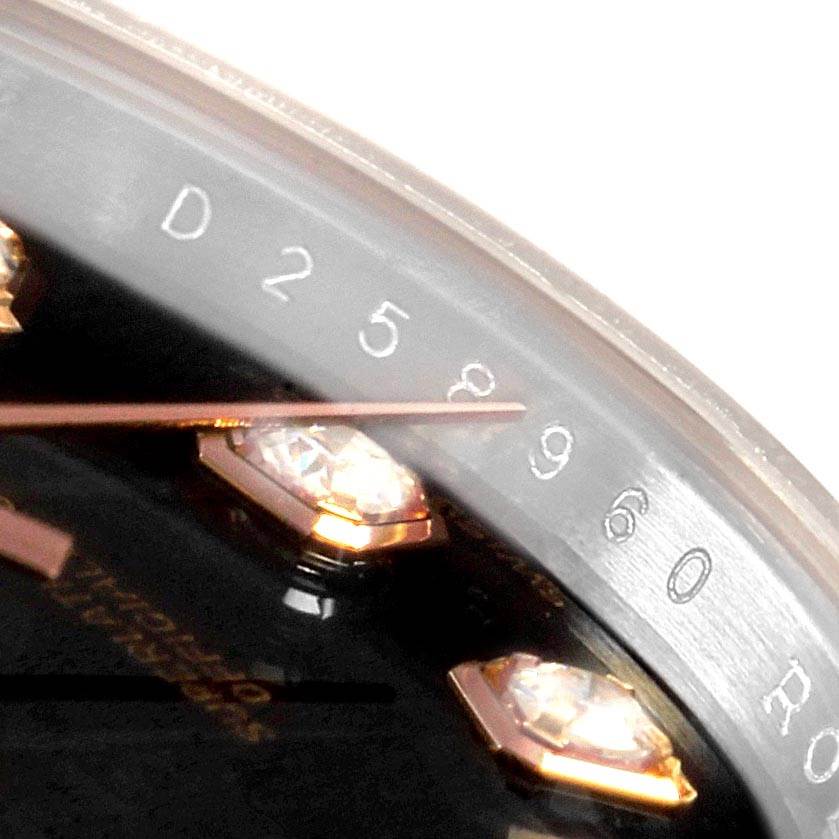 This close-up of the Rolex Datejust 179171 Women's Steel and Gold (two tone) Black Dial 179171 Women's Steel and Gold (two tone) Black Dial model shows part of the dial with diamond hour markers and the edge of the rehaut with engraved numbers.