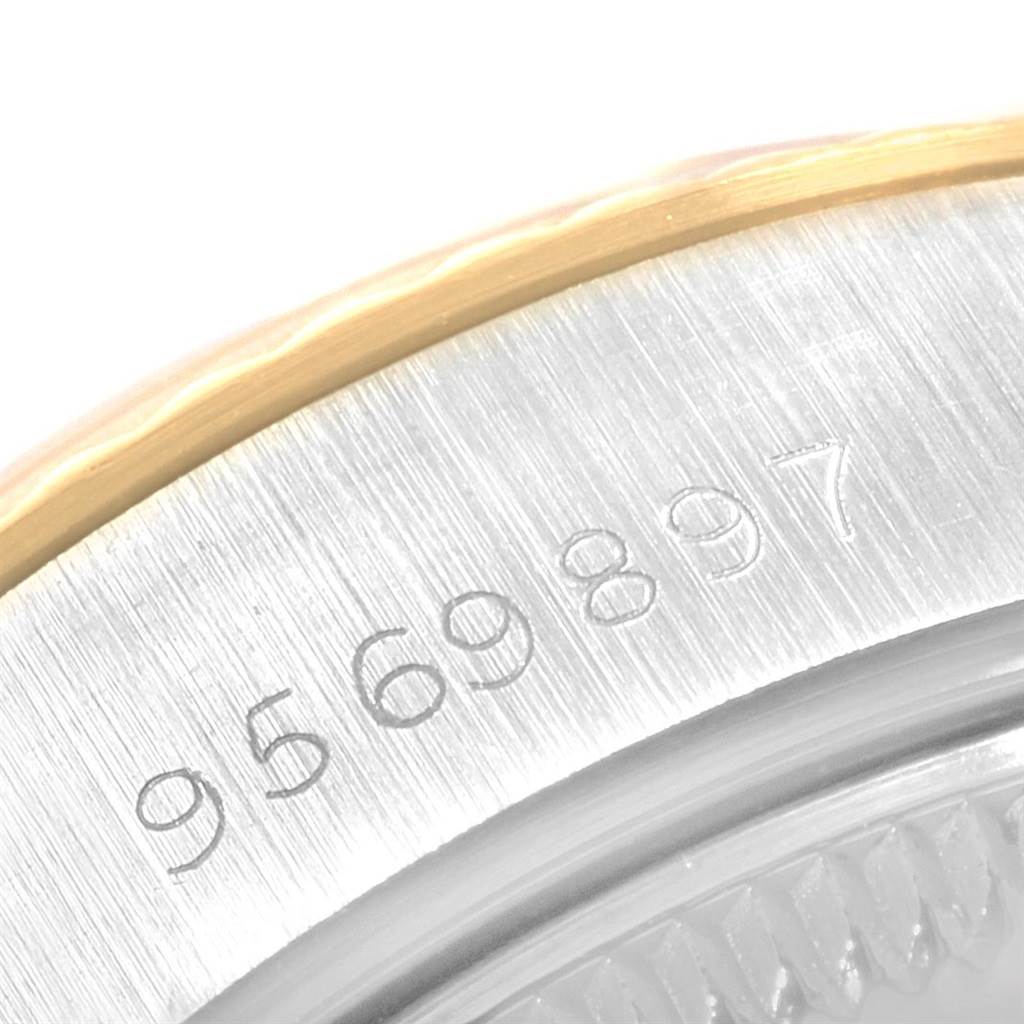 This close-up image shows the serial number area on the caseback edge of a Rolex Datejust 69173 Women
s Stainless Steel Champagne Dial 69173 Women
s Stainless Steel Champagne Dial watch.