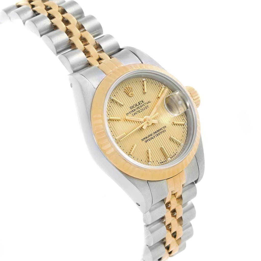 This Rolex Datejust 69173 Women
s Stainless Steel Champagne Dial 69173 Women
s Stainless Steel Champagne Dial model is shown at an angled view highlighting the face, bezel, crown, and two-tone bracelet.