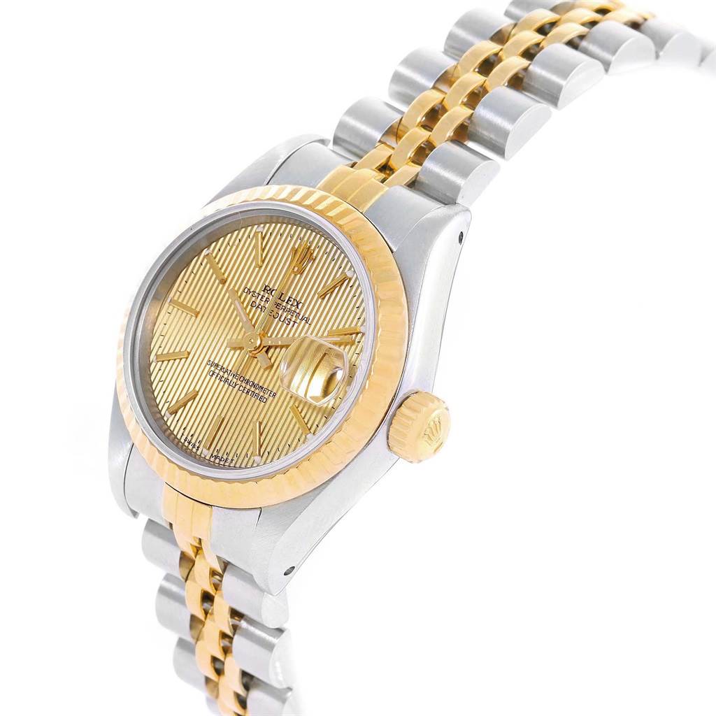 This image shows a Rolex Datejust 69173 Women
s Stainless Steel Champagne Dial 69173 Women
s Stainless Steel Champagne Dial model watch at an angled side view, highlighting its dial, crown, and part of the bracelet.