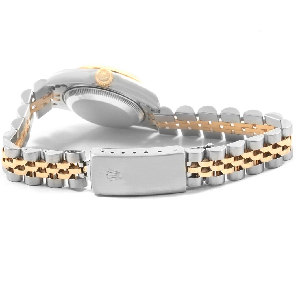 This image shows the side view of a Rolex Datejust 69173 Women's Stainless Steel Silver Dial 69173 Women's Stainless Steel Silver Dial watch, focusing on the case back, crown, and two-tone bracelet with clasp.