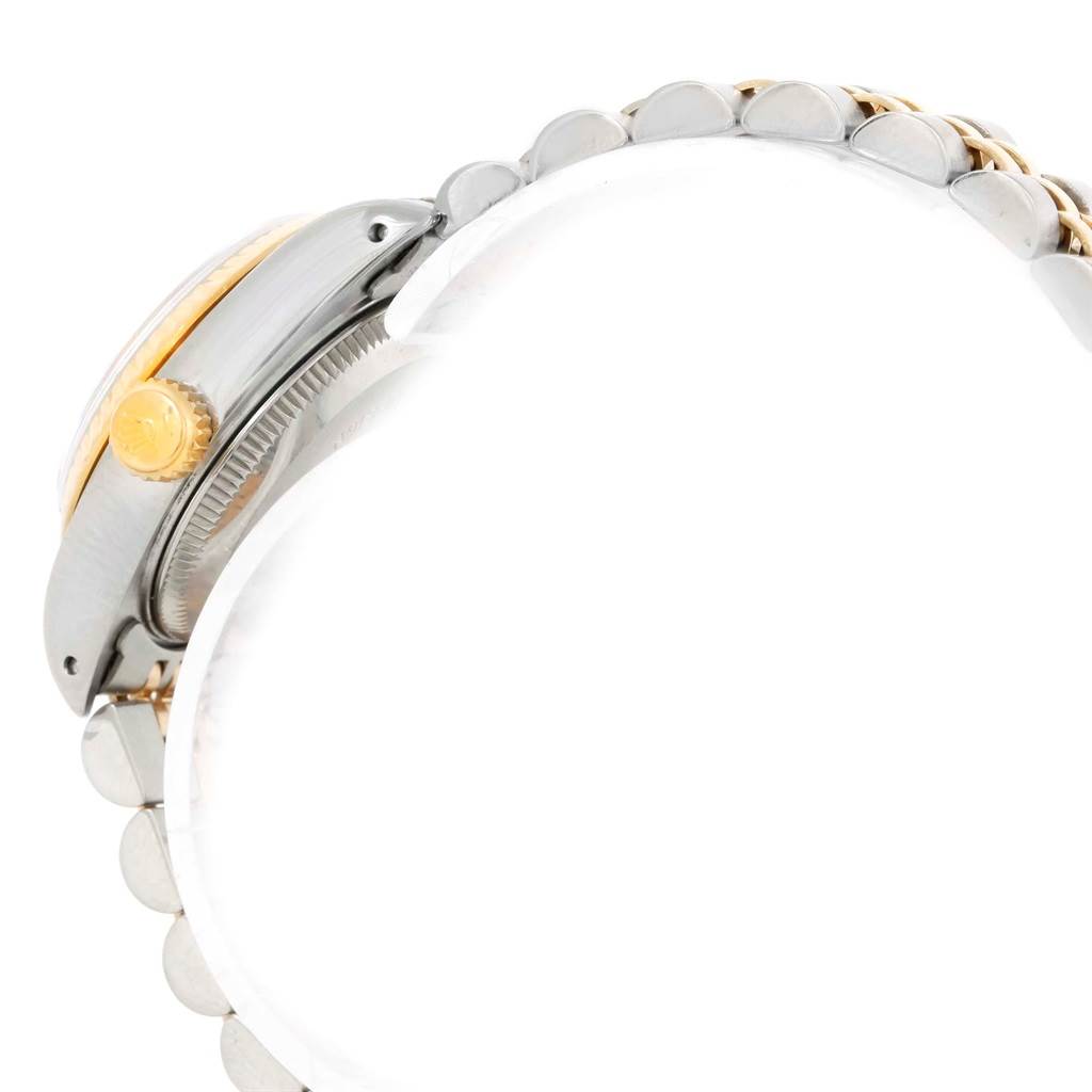 This image showcases a side view of a Rolex Datejust 69173 Women's Stainless Steel Black Dial 69173 Women's Stainless Steel Black Dial watch, highlighting the crown and part of the bracelet.