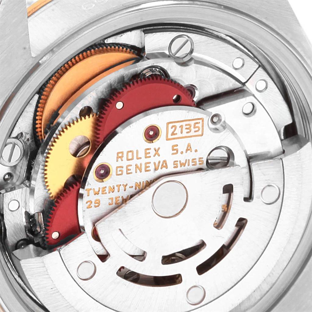 This is a close-up of the movement mechanism of a Rolex Datejust 69173 Women's Stainless Steel Black Dial 69173 Women's Stainless Steel Black Dial watch, showing internal gears and components.