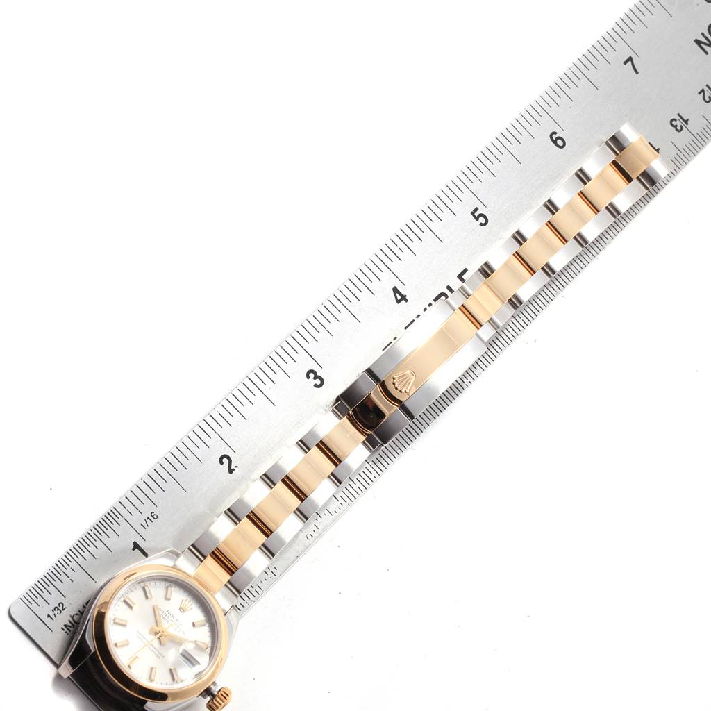 The image shows a Rolex Datejust 179163 Women's Steel and Gold (two tone) Silver Dial 179163 Women's Steel and Gold (two tone) Silver Dial watch laid flat, with its band and clasp measured against a ruler.