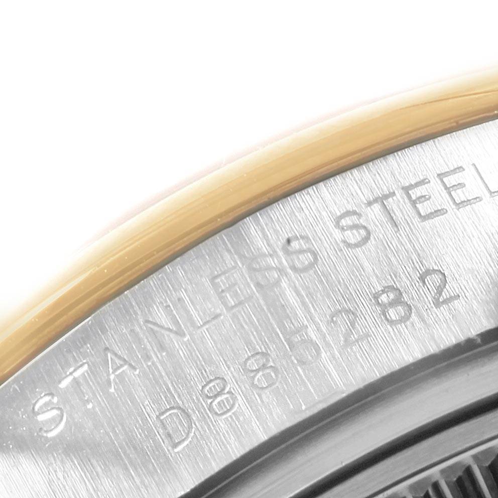 This image shows a close-up of the stainless steel case back and edge of the bezel of a Rolex Datejust 179163 Women's Steel and Gold (two tone) Silver Dial 179163 Women's Steel and Gold (two tone) Silver Dial watch.