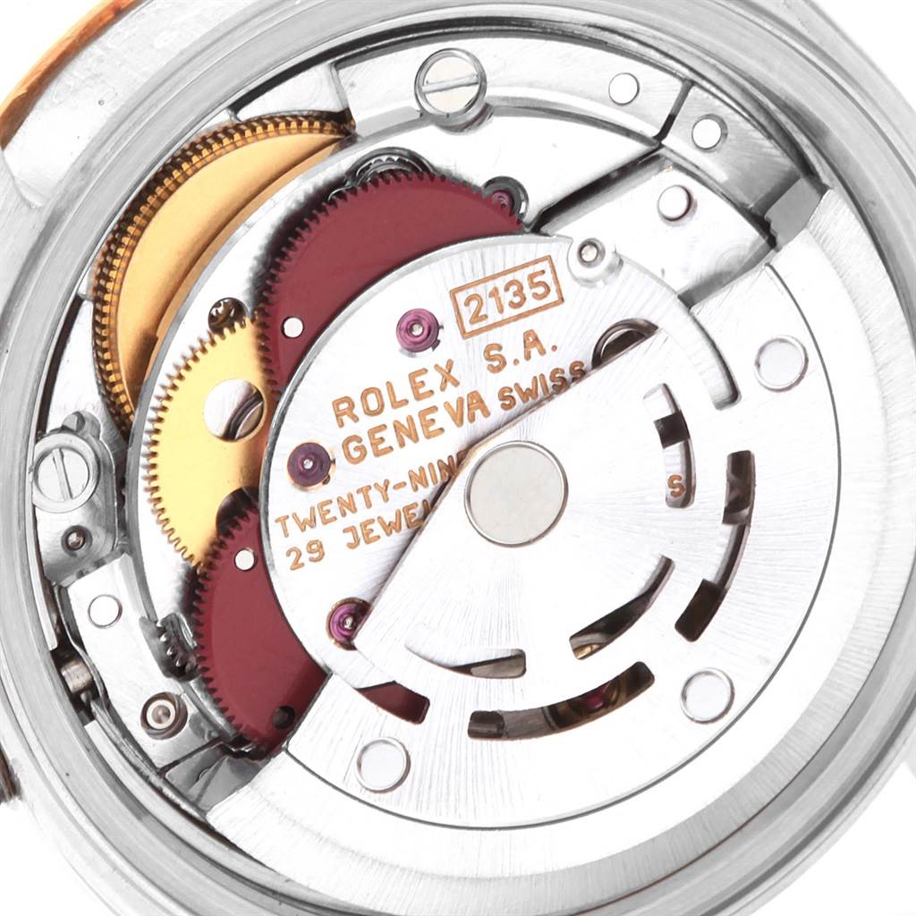 The image shows the inner mechanics and movement of a Rolex Datejust 69173 Women's Stainless Steel Silver Dial 69173 Women's Stainless Steel Silver Dial watch, highlighting gears and markings.