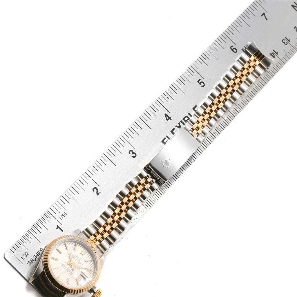 The image shows a Rolex Datejust 69173 Women's Stainless Steel Silver Dial 69173 Women's Stainless Steel Silver Dial watch with its face, bezel, and a portion of the bracelet, placed beside a ruler for measurement.