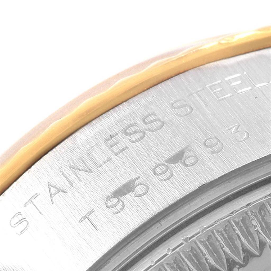 The image shows a close-up of the side and bezel of a Rolex Datejust 69173 Women's Stainless Steel Silver Dial 69173 Women's Stainless Steel Silver Dial model, highlighting the "STAINLESS STEEL" engraving.