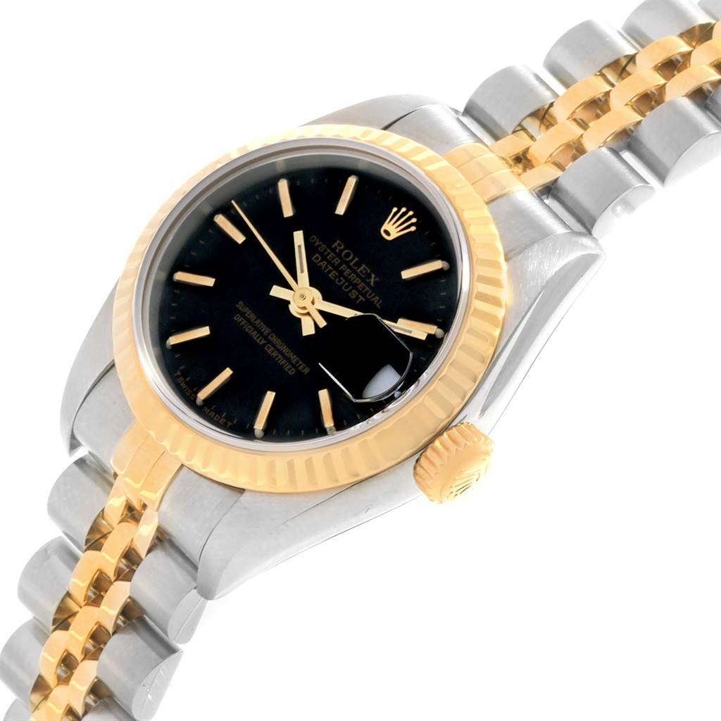 This image shows a Rolex Datejust 69173 Women's Stainless Steel Black Dial 69173 Women's Stainless Steel Black Dial watch at an angled view, highlighting its black dial, gold bezel, crown, and two-tone bracelet.