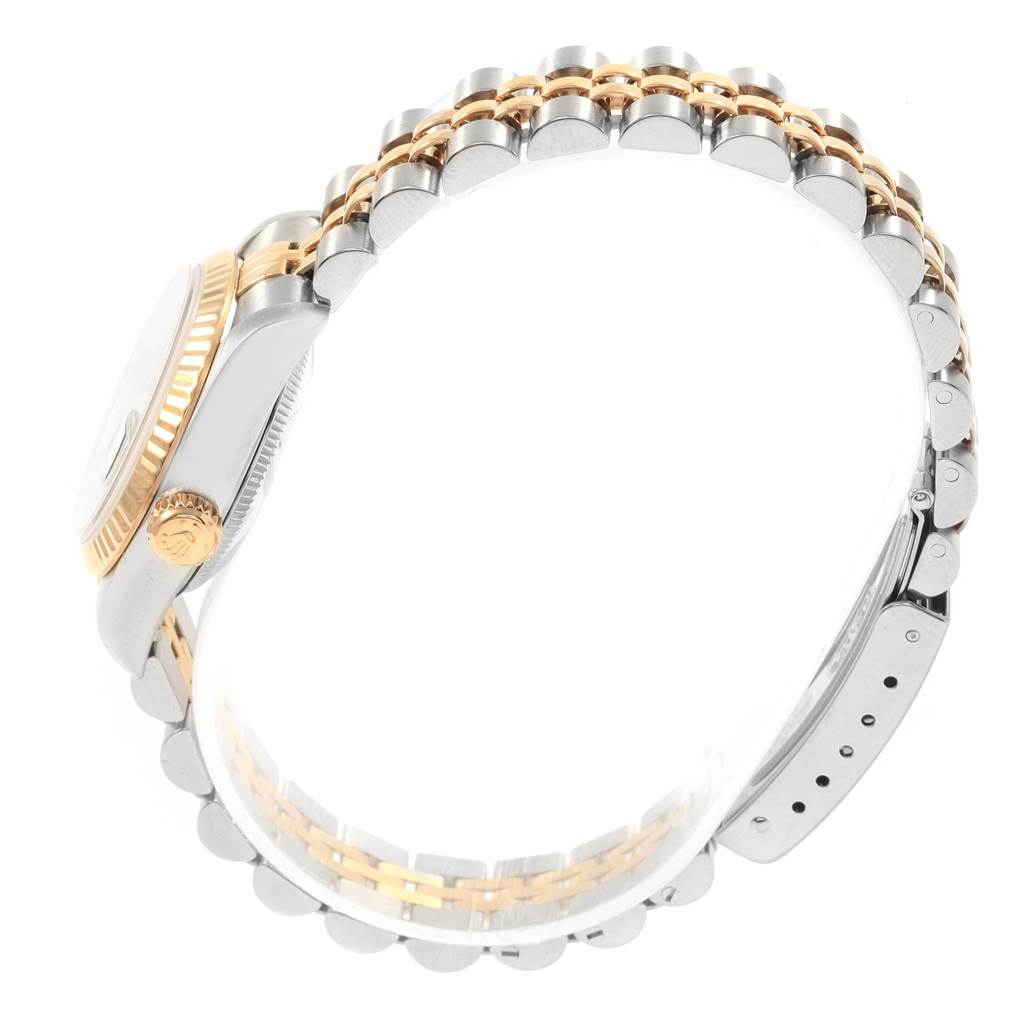 This image shows a side angle of the Rolex Datejust 69173 Women's Stainless Steel Black Dial 69173 Women's Stainless Steel Black Dial watch, focusing on the bezel, crown, and two-tone bracelet.