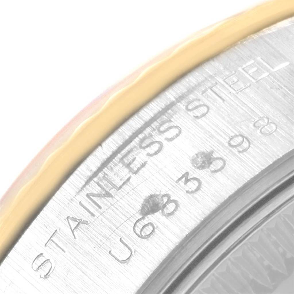 This image shows a close-up of the stainless steel case and part of the bezel of a Rolex Datejust 69173 Women's Stainless Steel Black Dial 69173 Women's Stainless Steel Black Dial watch.